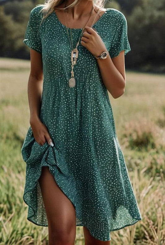 Dames midi-jurk met korte mouwen en stippenprint
